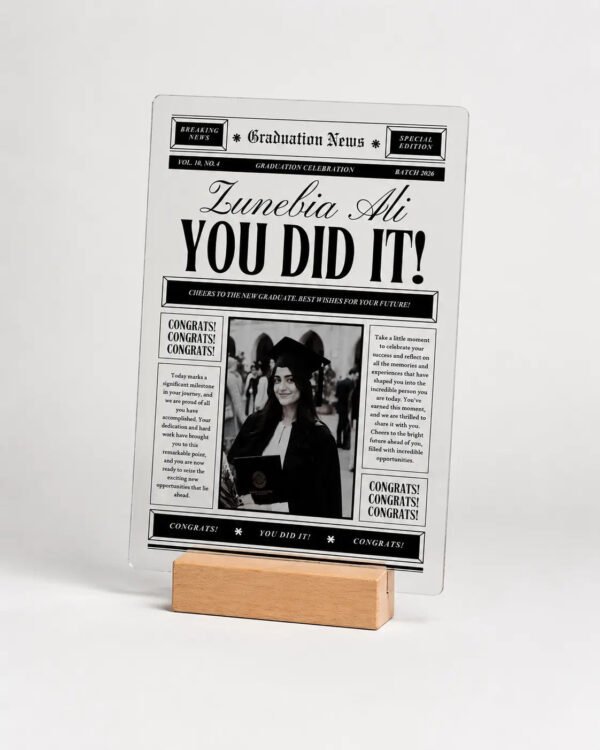 Graduation News Vintage Newspaper Plaque - Product Shot Vintage newspaper style graduation acrylic plaque with black and white photo on wooden stand