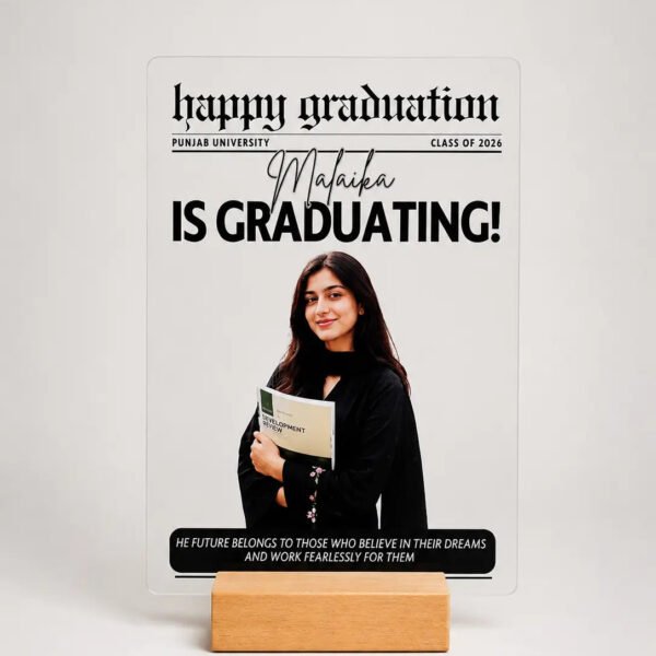 Graduation Newspaper Acrylic Frame - Product Shot Graduation newspaper style acrylic frame with photo name and university on wooden stand