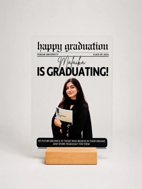 Graduation newspaper style acrylic frame with photo name and university on wooden stand