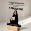Graduation newspaper acrylic frame side angle with wooden stand