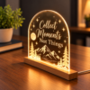 Engraved Acrylic LED Lamp – Right View Right-angle view of a glowing arched acrylic LED lamp with mountain engraving, stars, moon, and a slim wooden base.