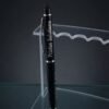 Custom fiber marked black metal pen on clear acrylic stand