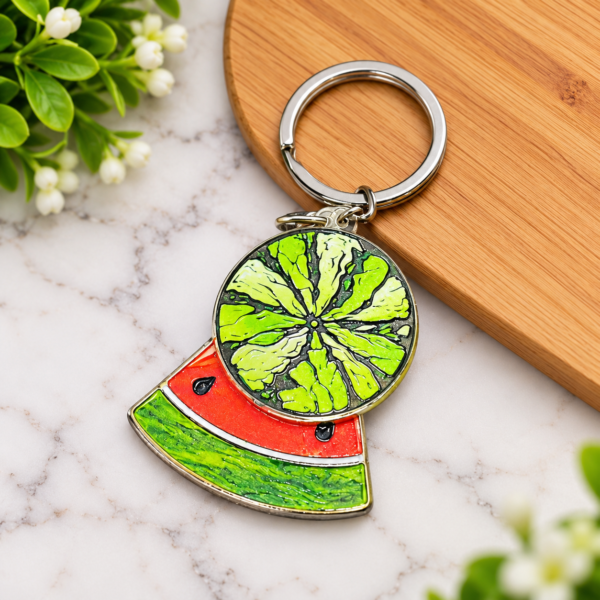 UV printed double fruit charm keychain with colorful lime and watermelon designs attached to one silver ring.