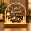 LED Wooden Base Acrylic Quote Lamp LED acrylic quote lamp with wooden base featuring Collect Moments Not Things and a glowing mountain forest design.